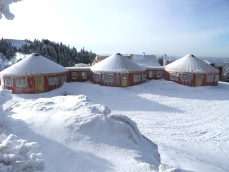 Mt. Orford Ski Resort in Quebec, Canada uses covered walkways to join their three yurts..